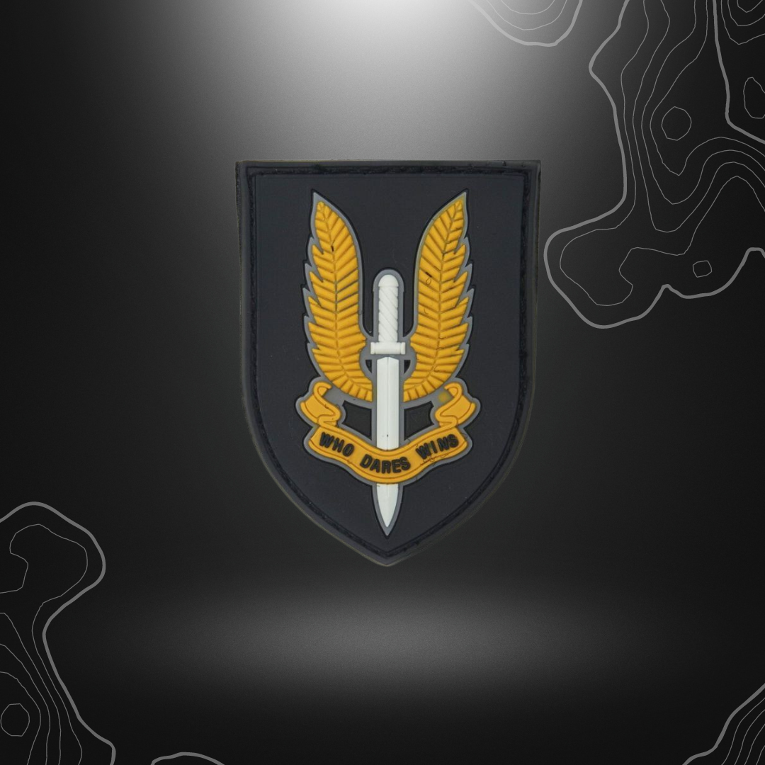 Patch noir en PVC avec l'inscription 'Who Dares Wins'
