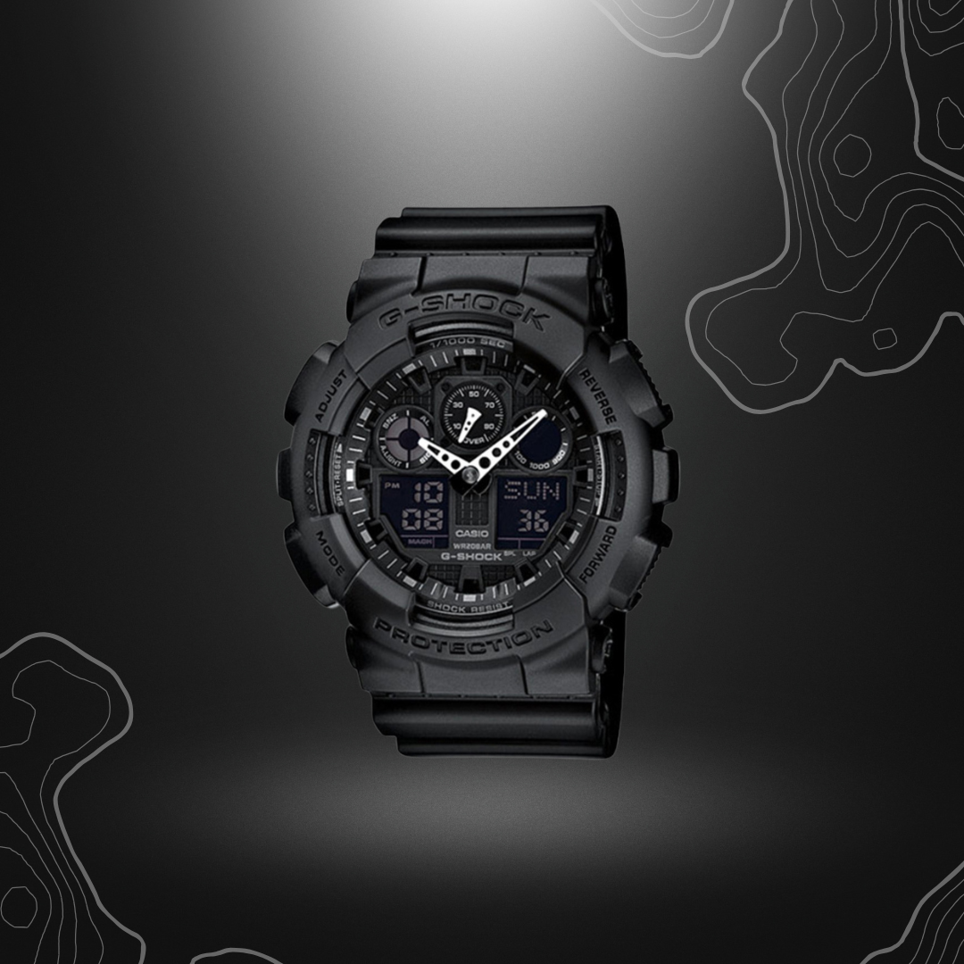 Montre G-Shock GA-100 noire de Casio avec cadran en verre minéral, bracelet en résine, affichages LCD, fonctionnalités multiples et résistance à l'eau