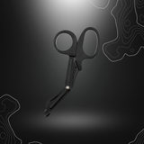 Alt tag SEO pour ciseaux de traumatologie noirs MFH, idéaux pour les trousses de premiers secours, avec lame incurvée d'urgence, pointe large et arrondie pour éviter les