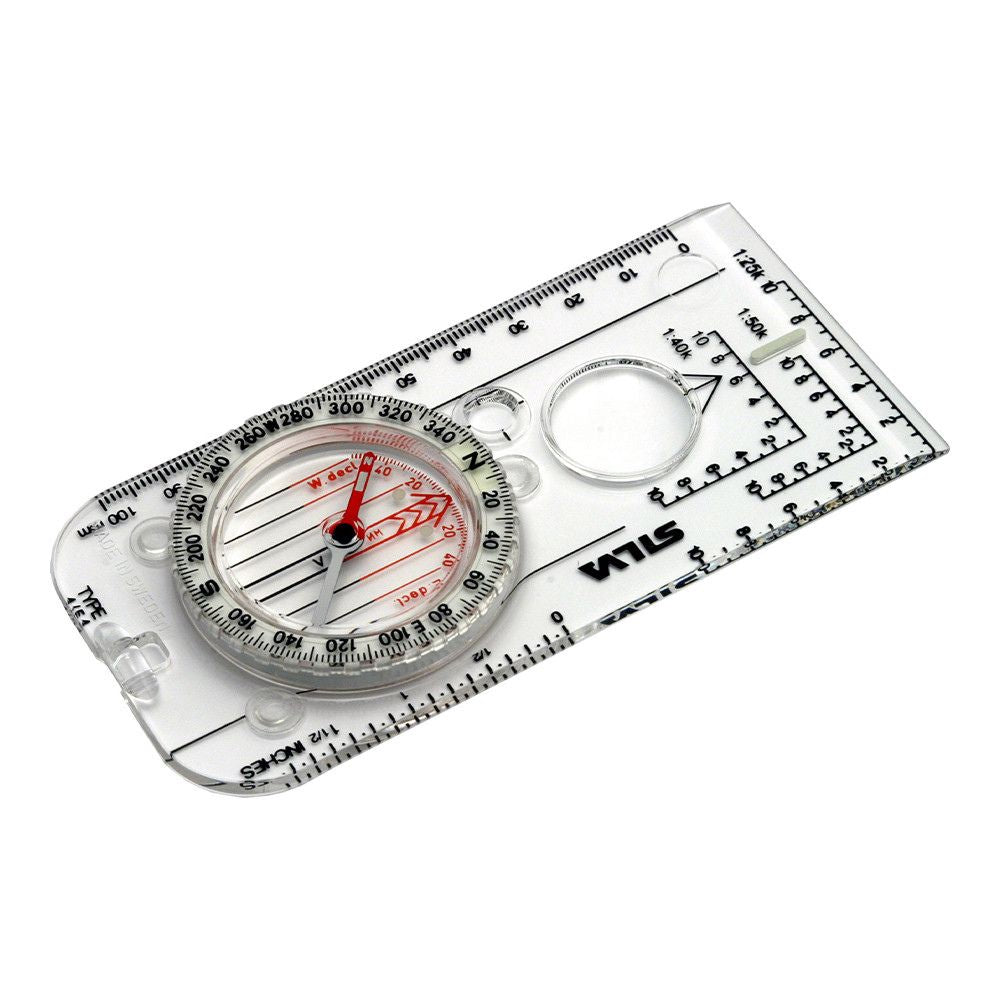 Boussole lumineuse Silva Expédition 4 avec picots en silicone antidérapant, repères phosphorescents pour lecture de nuit, échelles de mesure précises et cordon tour de cou vert olive