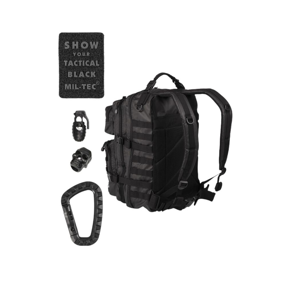 Balise alt : Sac à dos tactique Mil-Tec US Assault noir 36L, étanche, avec rembourrage en mousse EVA, divers compartiments et points de fixation Molle.