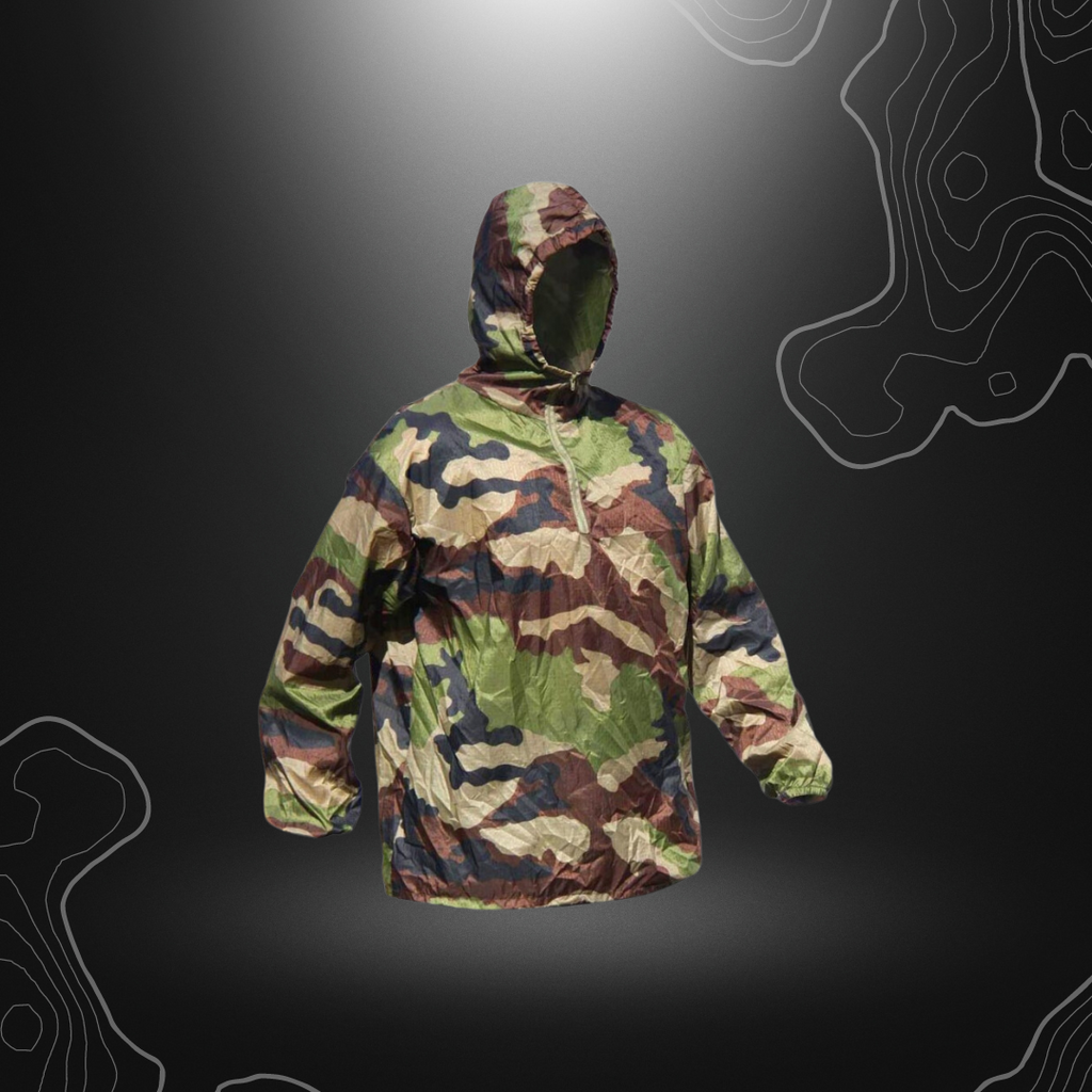 Veste coupe-vent Stowaway ultra-légère et compacte en nylon mini rip stop, résistante à la déchirure et déperlante grâce à un traitement DWR, avec capuche et poignets é