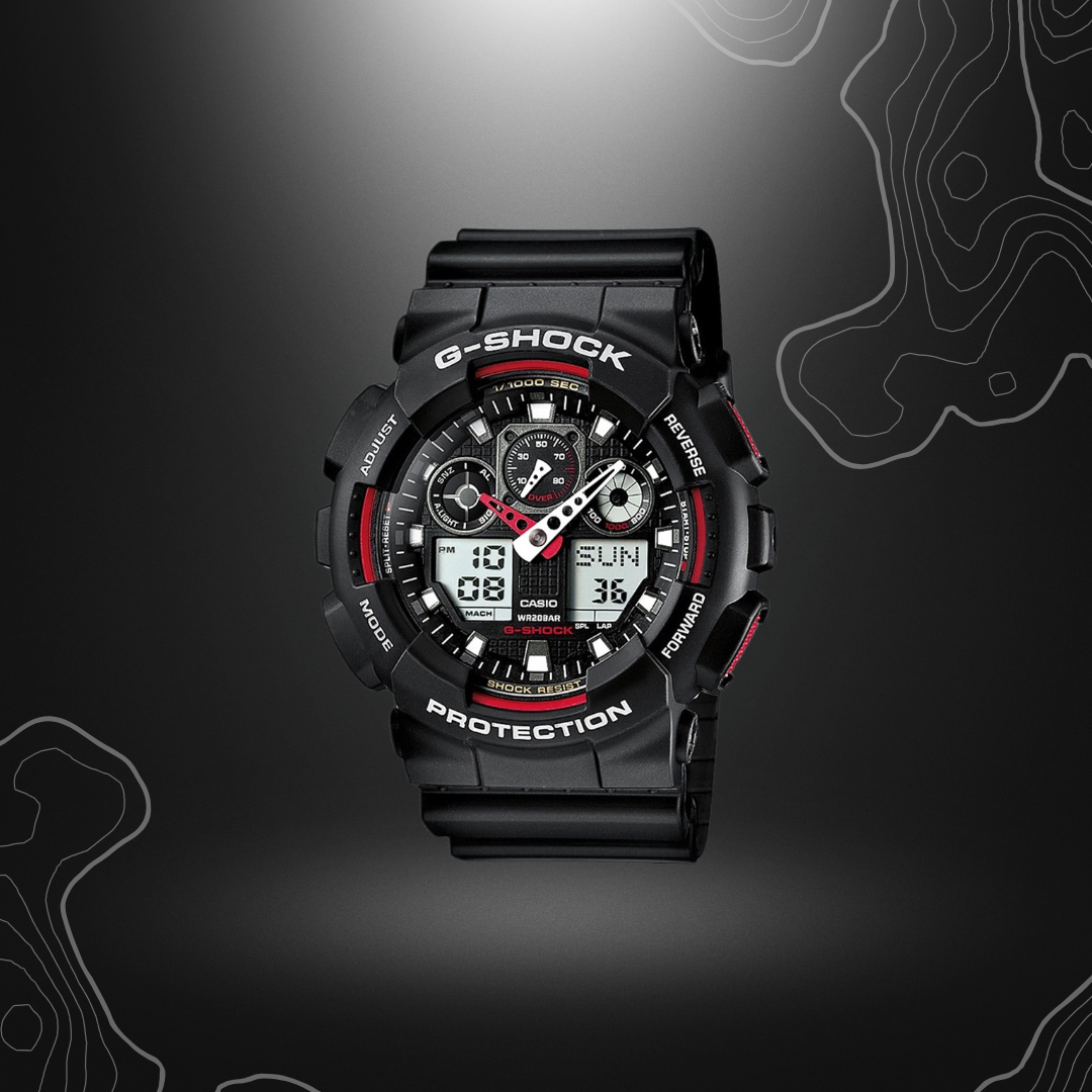Montre G-Shock GA-100 noir/rouge de Casio avec cadran en verre minéral, bracelet en résine, affichages LCD et résistance magnétique, équipée de multiples fonctionnalités comme un