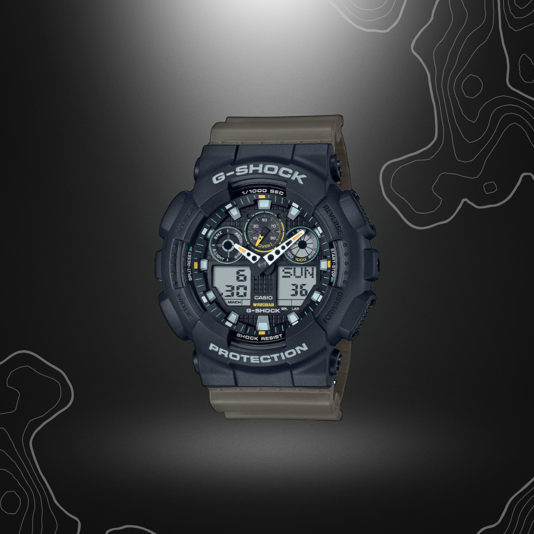 Montre G-Shock GA-100TU noir/vert olive de Casio avec cadran en verre minéral, bracelet en résine, affichages LCD, résistance magnétique et multiples fonctions.