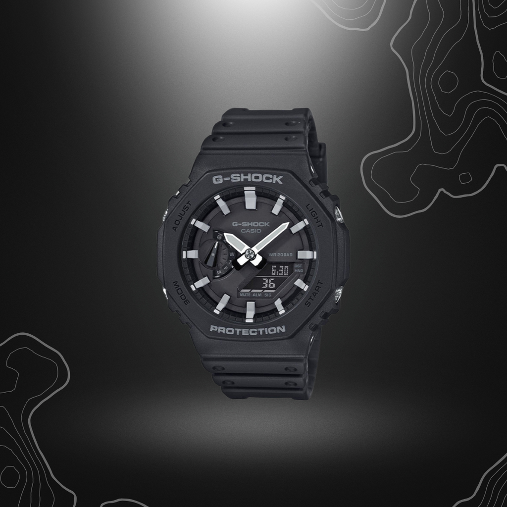 Montre G-Shock GA-2100 noir/gris de Casio avec cadran en verre minéral, boîtier et bracelet en résine, fonctionnalités numériques et analogiques, éclairage électrol