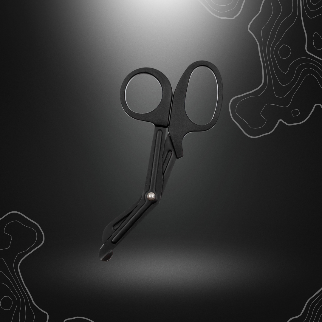 Alt tag SEO pour ciseaux de traumatologie noirs MFH, idéaux pour les trousses de premiers secours, avec lame incurvée d'urgence, pointe large et arrondie pour éviter les
