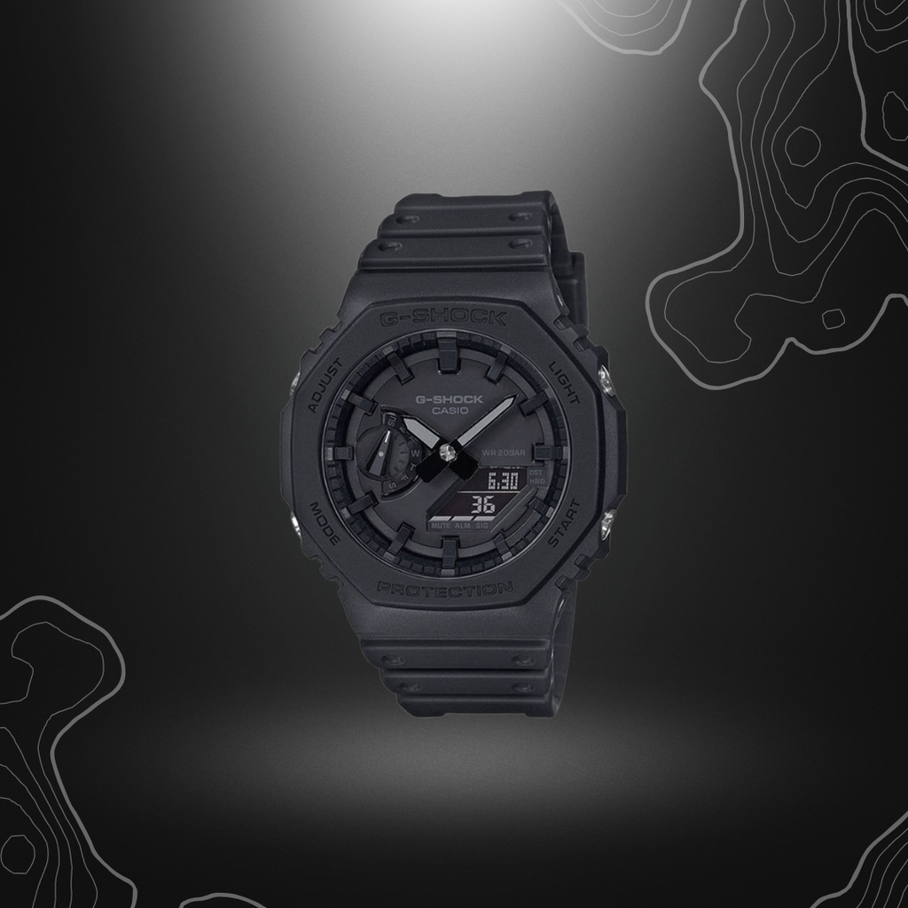 Montre G-Shock GA-2100 noire Casio avec cadran en verre minéral et bracelet en résine, dotée de fonctionnalités comme calendrier automatique, heure universelle, chronomètre et alarm