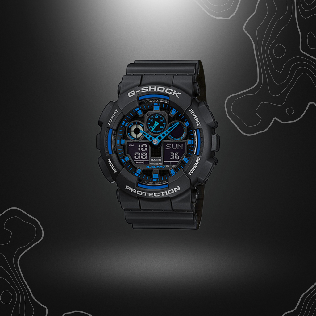 Montre G-Shock GA-100 noir/bleu de Casio avec cadran en verre minéral, bracelet en résine, affichages LCD, fonctionnalités multiples et étanchéité jusqu'à 20 bars